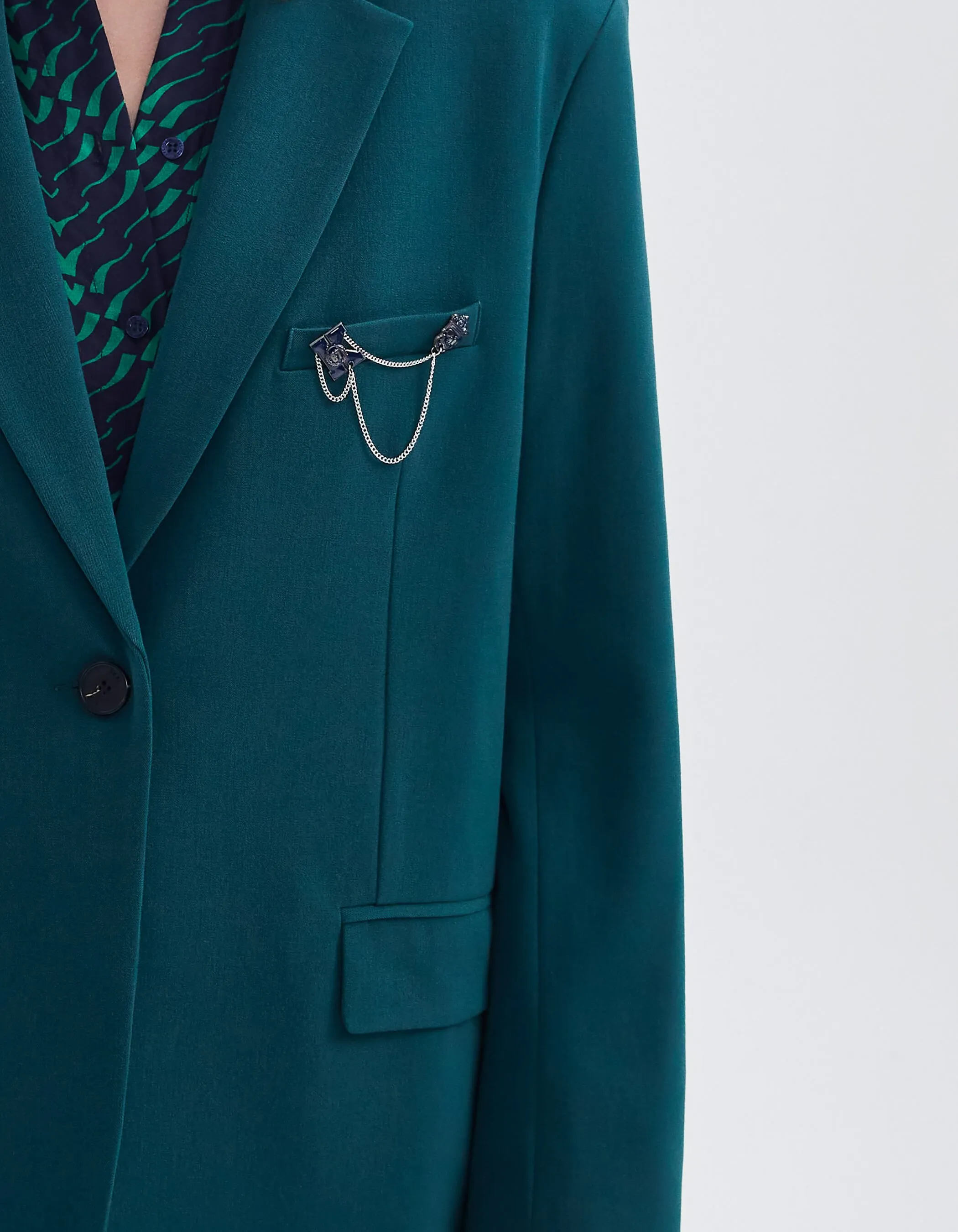 Green duck suit jacket with woman's pin's.